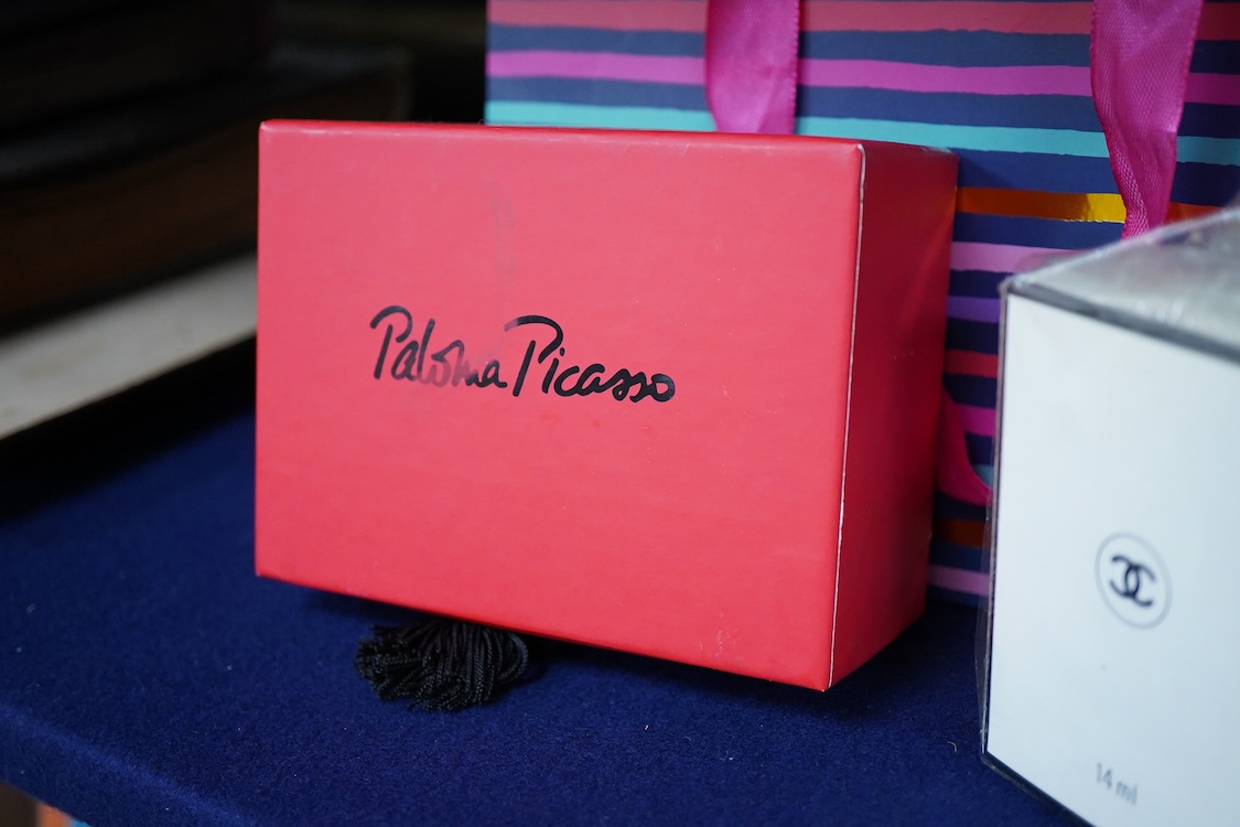 An unopened bottle of Chanel No.22 perfume, together with a boxed Paloma Picasso lipstick